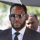 R. Kelly leaving court in Chicago June 26, 2019, following a hearing in the sex assault case he faces there. Now comes reports Kelly has been arrested on federal sex trafficking charges.